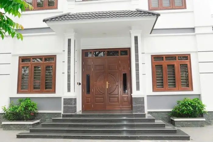 Mẫu cửa thép vân gỗ huỳnh trống đồng Goonsan